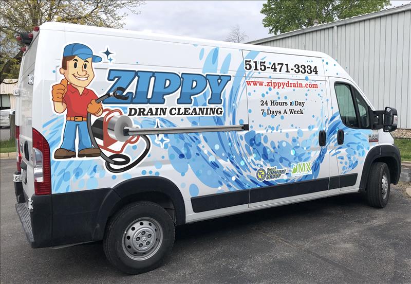 A white van with blue graphics advertises "Zippy Drain Cleaning" featuring a cartoon plumber holding a plunger. The van displays contact info, website, and notes 24-hour, 7-days-a-week service.